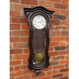 A DOUBLE WEIGHTED SERPENTINE REGULATOR VIENNA WALL CLOCK, having a mahogany case with arched top,