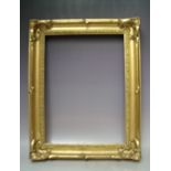 A 19TH CENTURY ART NOUVEAU GOLD SWEPT FRAME, frame W 7 cm, frame rebate 48 x 35 cm