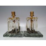 A PAIR OF CANDLE HOLDERS WITH WYVERN BASES ON GREEN MARBLE PLINTHS, A/F, H 20 cmCondition Report: