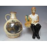 VINTAGE 1969 BALLANTINES LIQUOR PORCELAIN DECANTER IN THE FORM OF A SEATED FISHERMAN, together