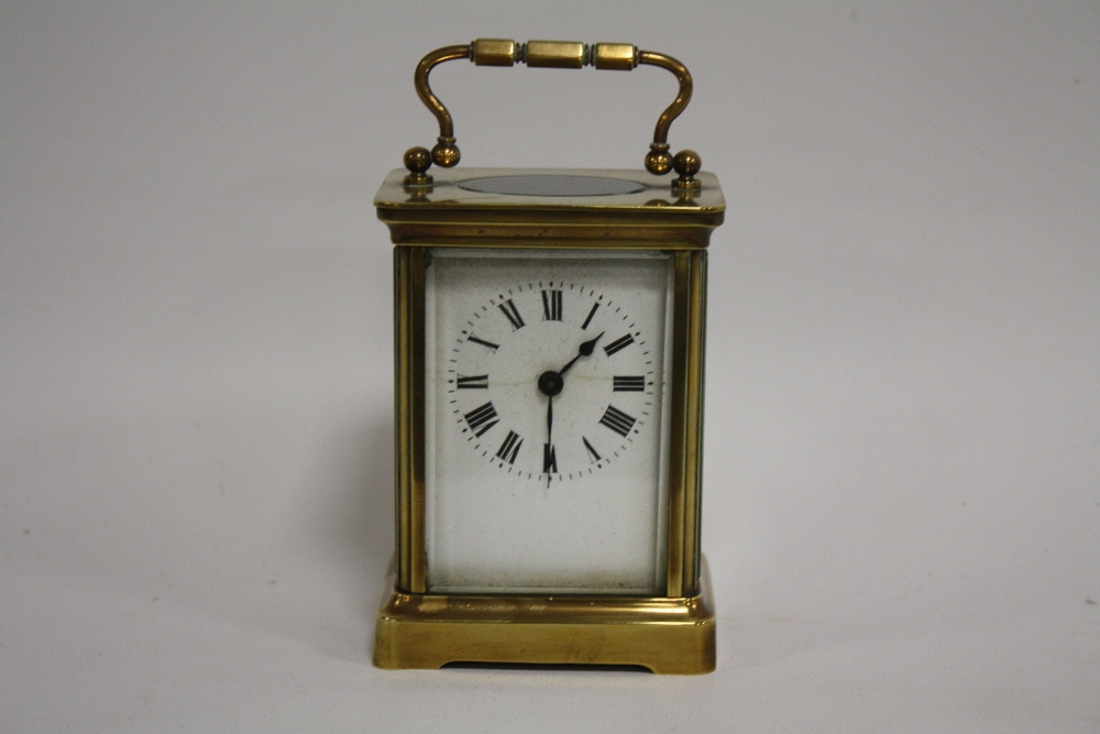 A SMALL BRASS CASED DUVERDREY & BLOQUEL CARRIAGE CLOCK, the enamel dial with Roman numerals, the