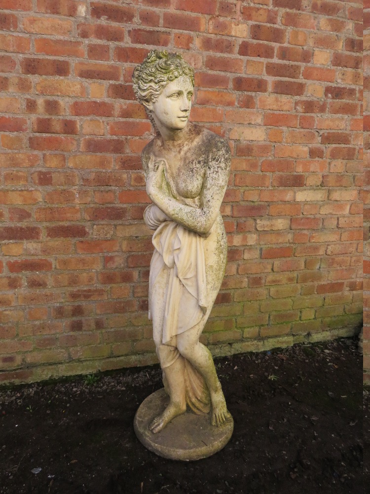 A LARGER STONE GARDEN FIGURE, in the form of a Grecian style figure in robe, H 160 cm