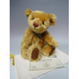 A STEIFF YEAR BEAR 'THE 2001 BEAR' 660344, button in ear with yellow tag, serial no 1999, with