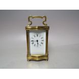 A FRENCH BRASS SERPENTINE FRONTED CARRIAGE CLOCK, H 12 cm