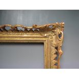 AN EARLY 20TH CENTURY CHIPPENDALE STYLE GOLD PIERCED FRAME, frame W 9 cm, frame rebate 52 x 31.5