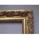 A 19TH CENTURY DECORATIVE GOLD FRAME, frame W 6.5 cm, frame rebate 33.5 cm, 38 cm