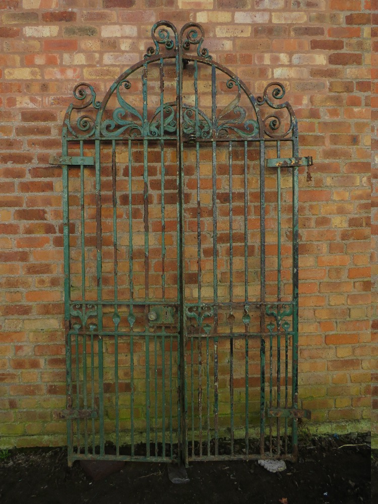 A PAIR OF 19TH CENTURY HAND FORGED WROUGHT IRON GATES, approx H 274 cm, approx W 158 cm hinge to