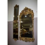 A HEAVY GILT WALL MIRROR 99 X 42 CM AND TWO FURTHER MIRRORS (3)