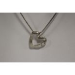 A STERLING SILVER HEART PENDANT ON SILVER CHAIN APPROX WEIGHT - 20.1G