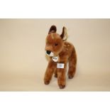 A STEIFF DEER SOFT TOY WITH LABEL IN EAR