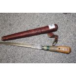 AN EASTERN STYLE DAGGER IN LEATHER SHEATH