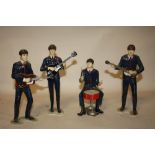 A SET OF FOUR REVELL INC. 1964 NEMS ENTERPRISES LTD. THE BEATLES FIGURES