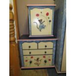 A MODERN PAINTED CHILDS SMALL CHEST OF DRAWERS H-76 W-81 CM AND A SINGLE DOOR CABINET