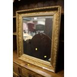 A GILT AND FOLIATE WALL MIRROR 76 X 66 CM S/D ( LOSSES TO MOULDING )