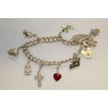 A MODERN STERLING SILVER CHARM BRACELET APPROX WEIGHT - 32G