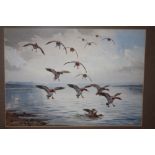 A GILT FRAMED AND GLAZED WATERCOLOUR DEPICTING DUCKS LANDING ON WATER SIGNED J C HARRISON LOWER