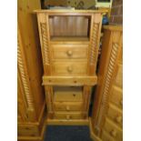 A PAIR OF PINE TWO DRAWER BEDSIDE CABINETS (2)