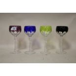A SET OF FOUR CUT AND COLOURED WINE GLASSES