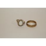 A HALLMARKED 9 CARAT GOLD WEDDING BAND, TOGETHER WITH A 9 CARAT GOLD OPAL SET DRESS RING APPROX