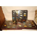 THREE PLASTIC DISPLAY CASES CONTAINING DIE CAST TOY CARS