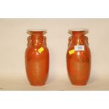 A PAIR OF ORIENTAL CERAMIC TWIN HANDLED VASES WITH ORANGE BACK STAMP, S/D, H 22.5 CM
