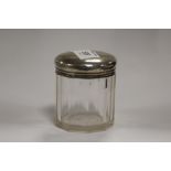 A HALLMARKED SILVER TOPPED VANITY JAR