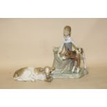 A LLADRO FIGURE OF A SEATED GIRL WITH A CALF TOGETHER WITH A LLADRO SEATED CALF FIGURE