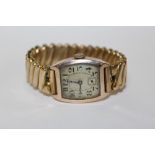 A VINTAGE HALLMARKED 9 CARAT GOLD CASED WRISTWATCH ON EXPANDABLE STRAP STAMPED B.W.C TO REVERSE OF