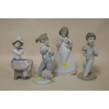 FOUR NAO FIGURES OF CHILDREN WITH DOGS
