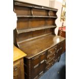 A DARK OAK ERCOL STYLE DRESSER W-144CM