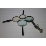 A GROUP OF FOUR VINTAGE MAGNIFYING GLASSES (4)