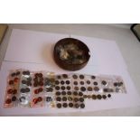 A WOODEN BOWL OF BRITISH AND WORLD COINS