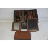 A TRAY OF ASSORTED VINTAGE PHOTOGRAPHIC PLATE HOLDERS AND PLATES, assorted sizes