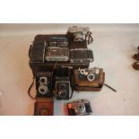 A SMALL CASE OF ASSORTED CAMERAS to include a Kodak 35, Argus, Koroll Film 120, Agfa Isolette