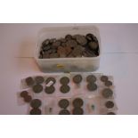 A TUB OF BRITISH AND WORLD COINS, to include a selection of half Crowns