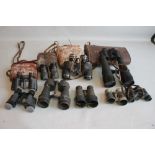 A GROUP OF VARIOUS BINOCULARS MOSTLY A/F, to include Telstar 45 x 70, and military types