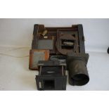 A TRAY OF PHOTOGRAPHIC EQUIPMENT to include magic lantern parts, plate holders etc.