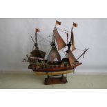 A PAINTED WOOD MODEL OF "THE GOLDEN HIND" GALLEON, with paper spills and full rigging