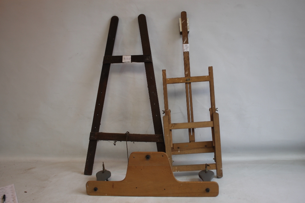 A SMALL ADJUSTABLE WOODEN ARTIST'S EASEL, H 85 cm, together with another slightly larger easel and a