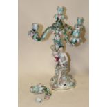 A PAIR OF MEISSEN STYLE FIGURAL FIVE BRANCH CANDELABRA, each column modelled as a seated lady