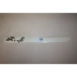 A JAPANESE MEIJI PERIOD IVORY PAGE TURNER WITH SILVER SCROLLING DETAIL, the silver formed as a