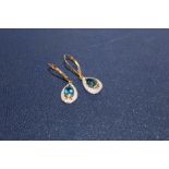 A PAIR OF LADIES 9 CT GOLD EARRINGS SET WITH BLUE TOPAZ STONES