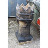 A CROWN TOPPED CHIMNEY TOPPER