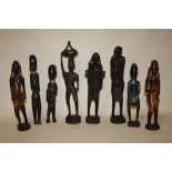 A COLLECTION OF EIGHT ASSORTED CARVED WOODEN TRIBAL STYLE FIGURES