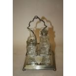 A SILVER PLATED FOUR BOTTLE CRUET SET, A/F