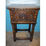 AN ANTIQUE OAK POT CUPBOARD