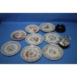 A COLLECTION OF ROYAL DOULTON "THE SNOWMAN" PLATES, GLASS DOME, TOGETHER WITH A CARVED CANDLE HOLDER