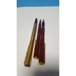 A PARKER 88 MAROON & GOLD FOUNTAIN PEN, gold plated (1988) together with two Parker Imperial Line (