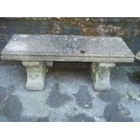 A LARGE HEAVY RECONSTITUTED STONE TWIN PEDESTAL GARDEN SEAT