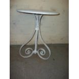 AN ANTIQUE WROUGHT IRON GARDEN TABLE (REPAIRED)